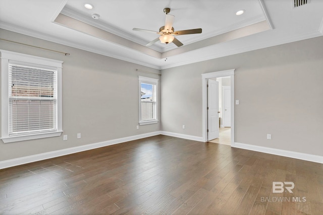 10606 Secretariat Blvd, Daphne, AL 36526 - spare room featuring recessed lighting, dark wood-style flooring, ceiling fan, a tray ceiling, and ornamental molding