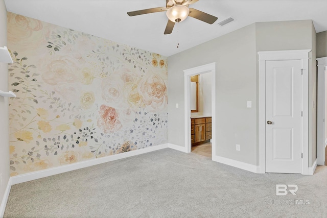 10606 Secretariat Blvd, Daphne, AL 36526 - unfurnished bedroom featuring light colored carpet, visible vents, ensuite bathroom, baseboards, and a ceiling fan