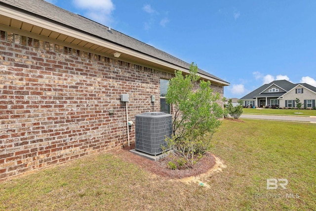 10606 Secretariat Blvd, Daphne, AL 36526 - view of property exterior with brick siding, cooling unit, and a yard