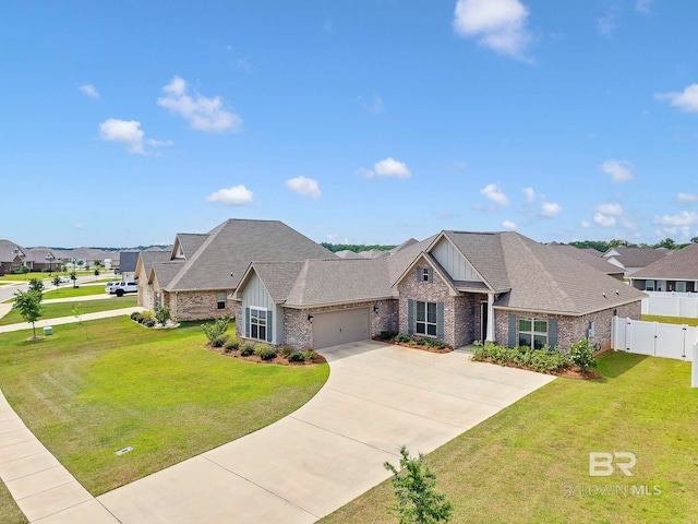 10606 Secretariat Blvd, Daphne, AL 36526 - craftsman-style house featuring board and batten siding, brick siding, fence, a front yard, and an attached garage