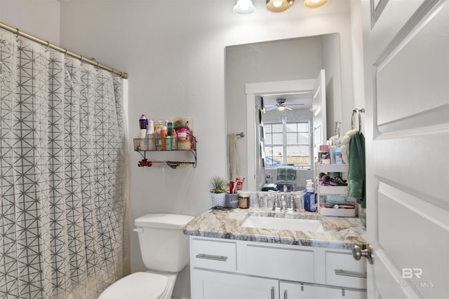 bathroom with ceiling fan, vanity, and toilet