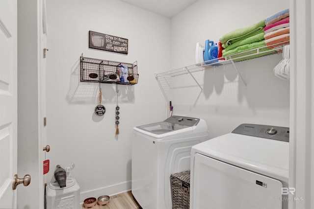 washroom featuring washer and dryer and hardwood / wood-style floors