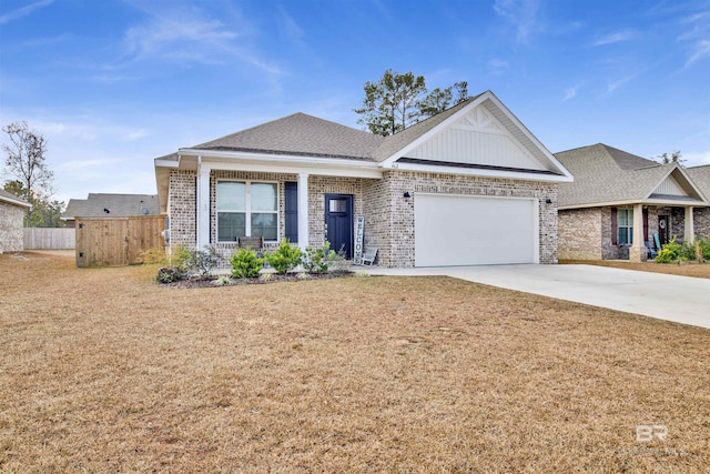 view of front of property featuring a garage and a front lawn