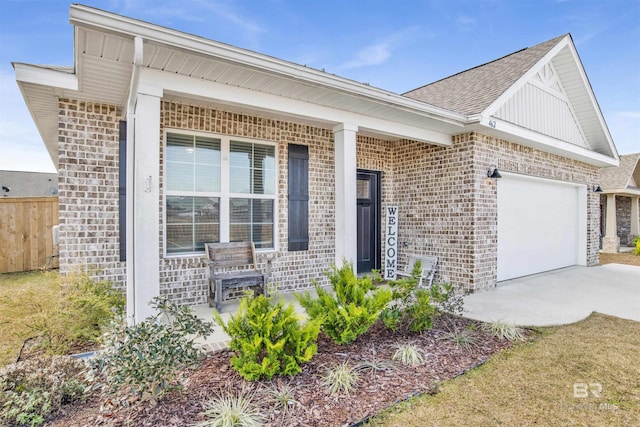 ranch-style home featuring a garage and covered porch