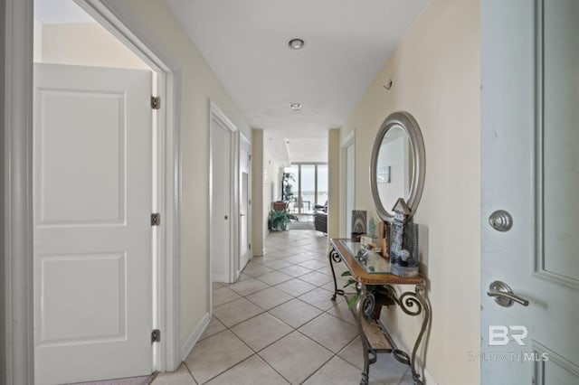 corridor featuring light tile patterned floors