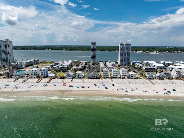 birds eye view of property with a view of the beach and a water view