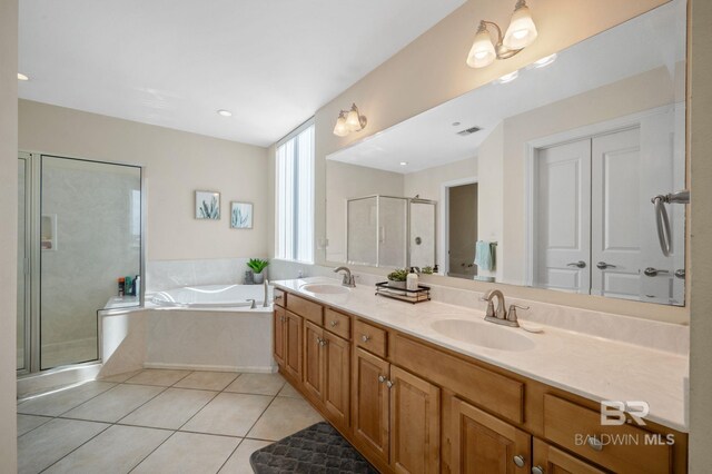 bathroom featuring tile patterned flooring, vanity, and independent shower and bath