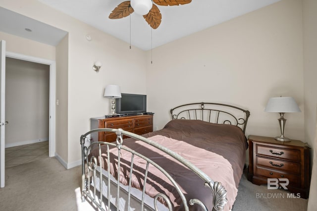 bedroom with light carpet and ceiling fan