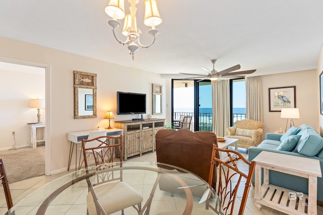 24230 Perdido Beach Blvd Unit 3014, Orange Beach, AL 36561 - living area with a ceiling fan, light tile patterned floors, light colored carpet, baseboards, and a chandelier