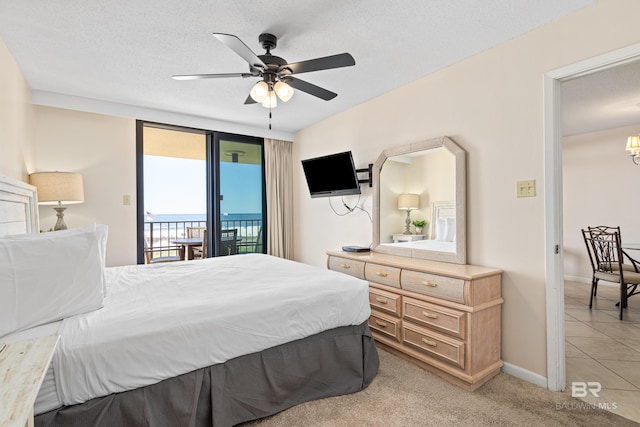 24230 Perdido Beach Blvd Unit 3014, Orange Beach, AL 36561 - bedroom with access to exterior, a chandelier, ceiling fan, baseboards, and light tile patterned flooring