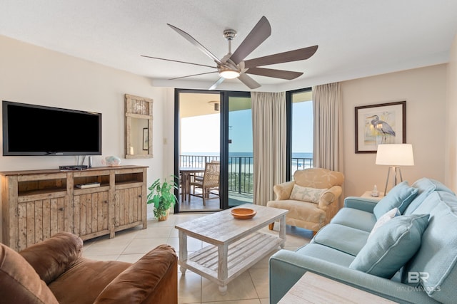 24230 Perdido Beach Blvd Unit 3014, Orange Beach, AL 36561 - living room with ceiling fan and light tile patterned floors
