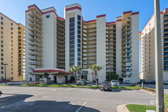 24230 Perdido Beach Blvd Unit 3014, Orange Beach, AL 36561 - view of apartment building / complex with uncovered parking
