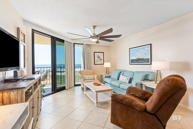 24230 Perdido Beach Blvd Unit 3014, Orange Beach, AL 36561 - living area with a ceiling fan and light tile patterned floors