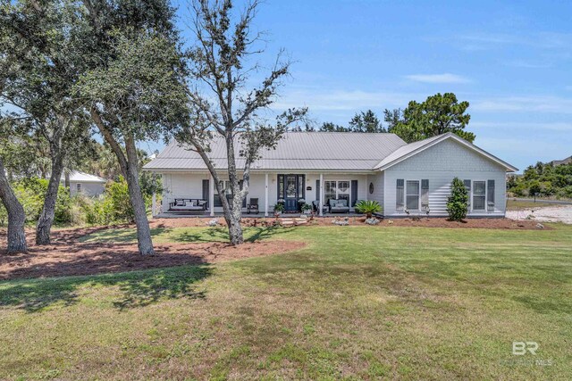 ranch-style home with a front lawn