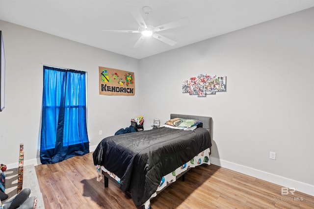 bedroom featuring hardwood / wood-style floors and ceiling fan