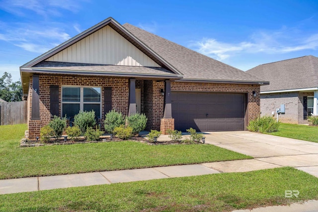 view of front of house featuring a front yard and a garage