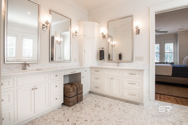 bathroom with vanity and ornamental molding