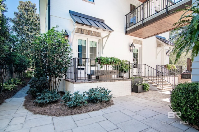 doorway to property with a patio area and a balcony