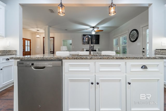 kitchen featuring decorative light fixtures, visible vents, white cabinetry, and stainless steel dishwasher