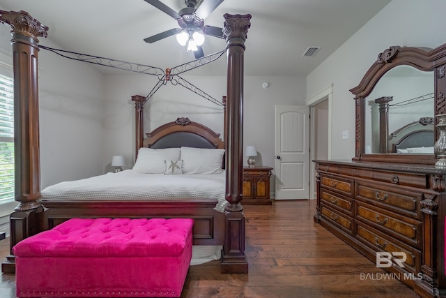 bedroom with wood finished floors and visible vents