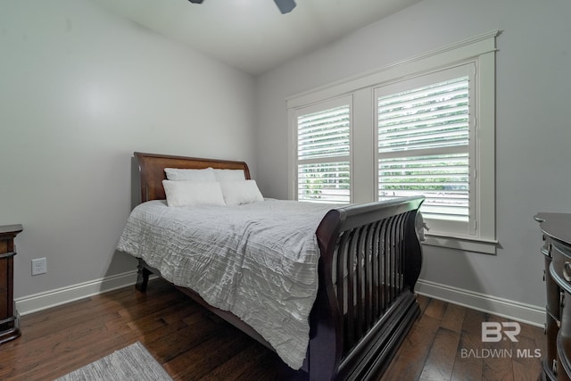 bedroom with lofted ceiling, ceiling fan, and dark hardwood / wood-style flooring