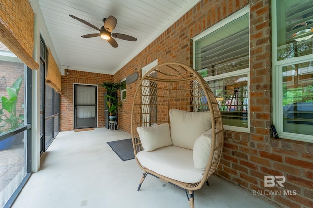 unfurnished sunroom with plenty of natural light and ceiling fan