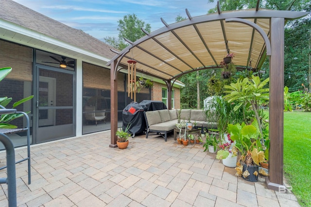 view of patio featuring an outdoor living space, a sunroom, and a pergola