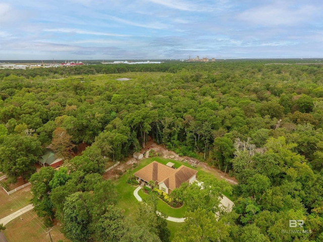 bird's eye view featuring a wooded view