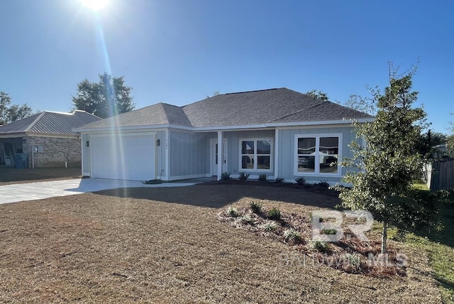 single story home featuring concrete driveway, roof with shingles, and an attached garage