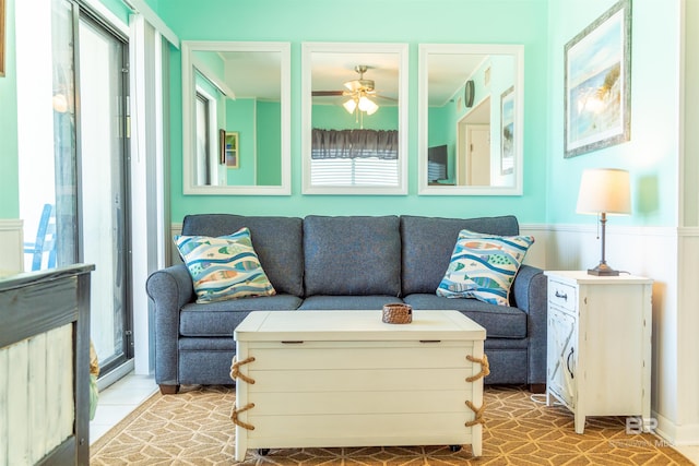 living room with a healthy amount of sunlight and ceiling fan