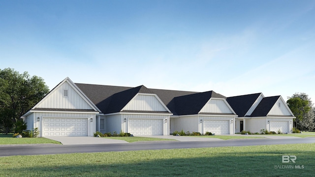 view of front of home featuring a front yard and a garage