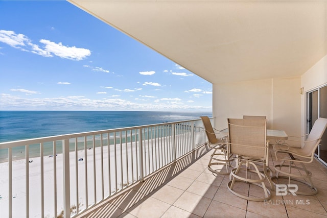 balcony with a view of the beach and a water view