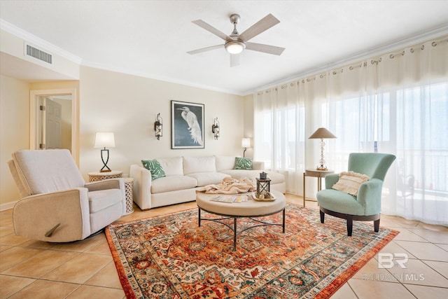 living room with ceiling fan, light tile patterned floors, and a healthy amount of sunlight