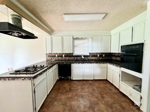 kitchen featuring white cabinetry, black appliances, sink, and backsplash