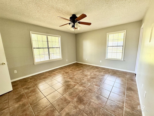 2316 Reneke Ave, Mobile, AL 36605 - tiled spare room featuring ceiling fan and a textured ceiling