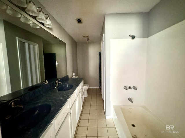 full bathroom with toilet, tub / shower combination, vanity, and tile patterned floors