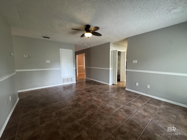 2316 Reneke Ave, Mobile, AL 36605 - empty room featuring ceiling fan, a textured ceiling, and dark tile patterned floors