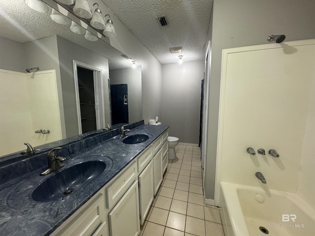 2316 Reneke Ave, Mobile, AL 36605 - bathroom with a textured ceiling, tile patterned flooring, double vanity, and tub / shower combination