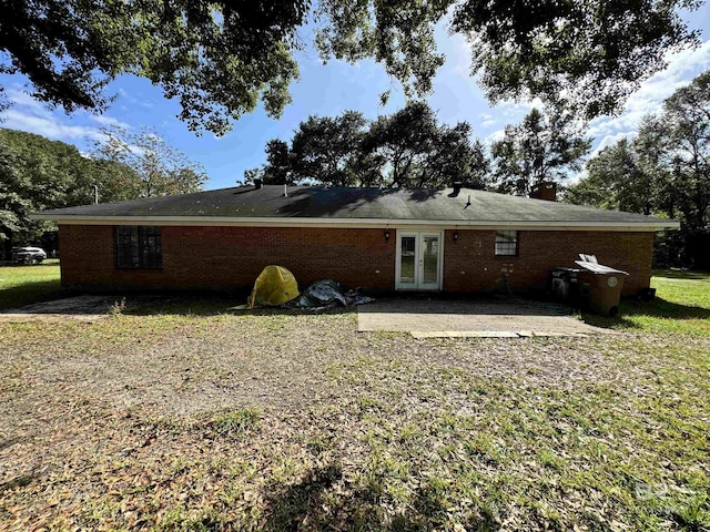 2316 Reneke Ave, Mobile, AL 36605 - rear view of property with french doors, a patio area, a lawn, and brick siding