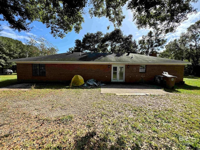 rear view of property with a patio area and french doors