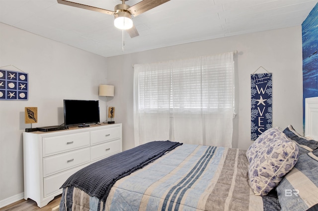 930 W Beach Blvd Unit 106, Gulf Shores, AL 36542 - bedroom featuring light wood-type flooring and a ceiling fan