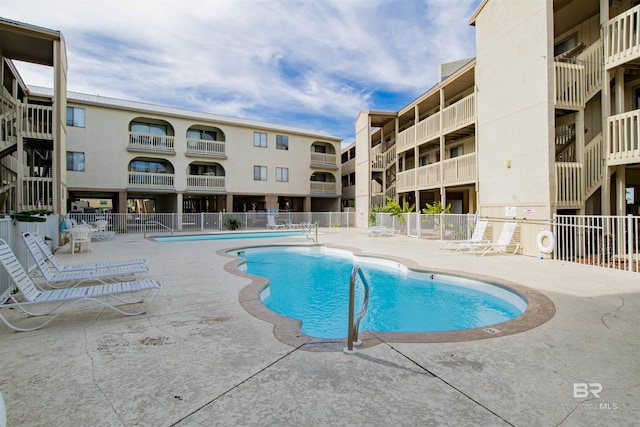 930 W Beach Blvd Unit 106, Gulf Shores, AL 36542 - community pool with fence and a patio area