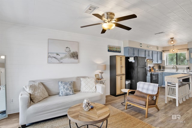 930 W Beach Blvd Unit 106, Gulf Shores, AL 36542 - living area with light wood-type flooring and ceiling fan