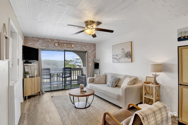 930 W Beach Blvd Unit 106, Gulf Shores, AL 36542 - living area featuring light wood-style floors and a ceiling fan