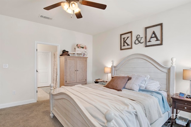 carpeted bedroom featuring visible vents, baseboards, and a ceiling fan