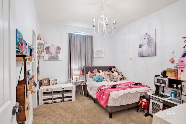 bedroom with an inviting chandelier and carpet