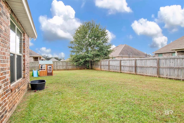 view of yard with a fenced backyard