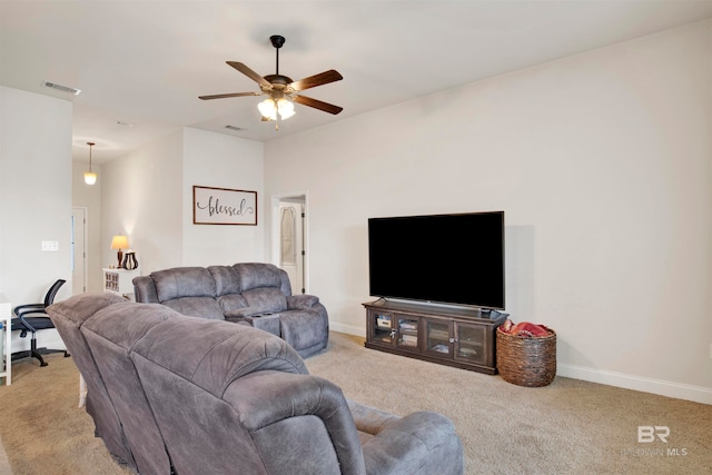 living area with ceiling fan, baseboards, visible vents, and light carpet