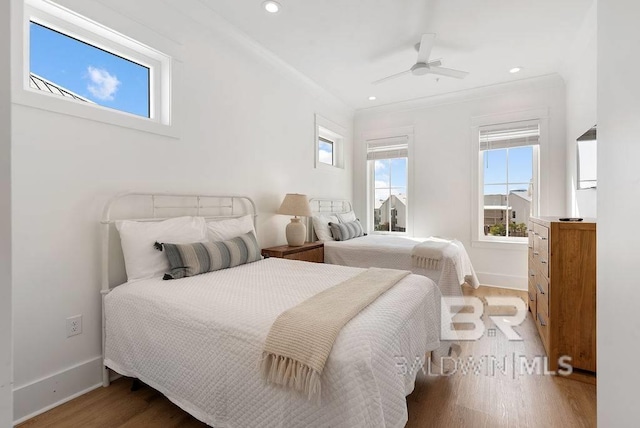 bedroom featuring a ceiling fan, wood finished floors, baseboards, and recessed lighting