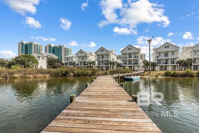 dock area with a water view and a residential view